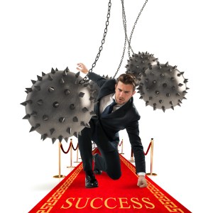 Businessman overcomes obstacles and reach the success
