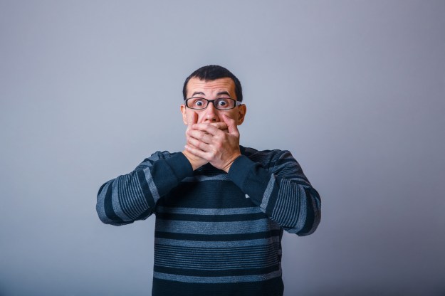 European-looking male of about thirty-closed mouth with her hand